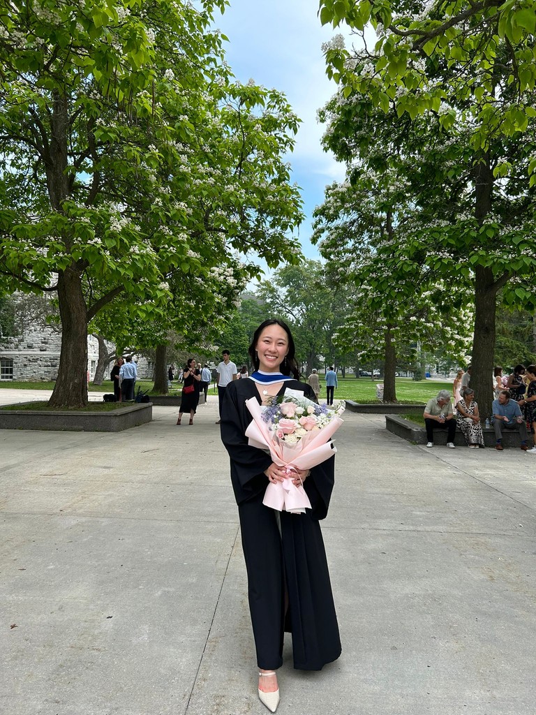 Christine Ha on the Queen's University campus at graduation.