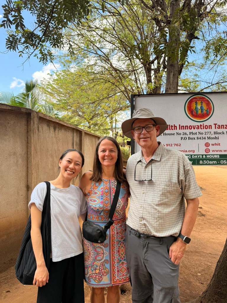 WHIT team members meeting with Dr. Archer during a community and research visit.